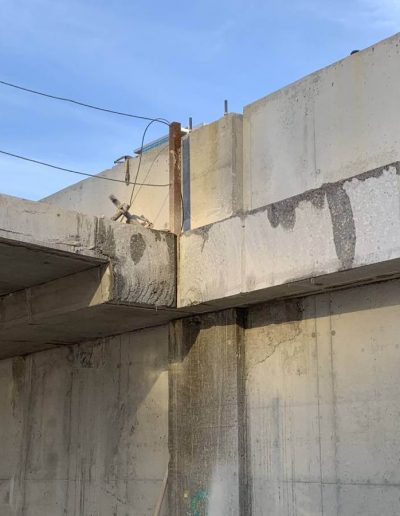 Concrete cutting selective demolition work on parking extension.