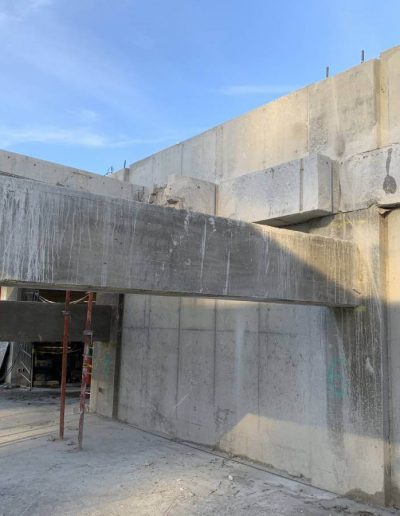 Concrete cutting selective demolition work on parking extension.