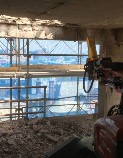 Robotic hammering machine used as concrete breaker.