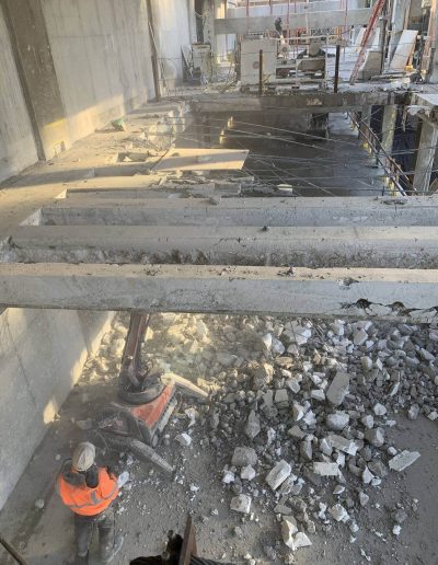 Concrete cutting selective demolition work on parking extension.