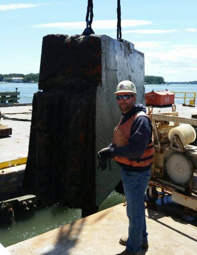 Underwater concrete and metal cutting to foundation for selective demolition.