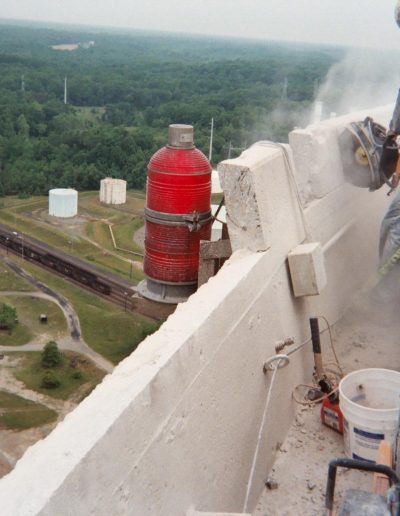 Concrete chop sawing work in progress by specialized worker.