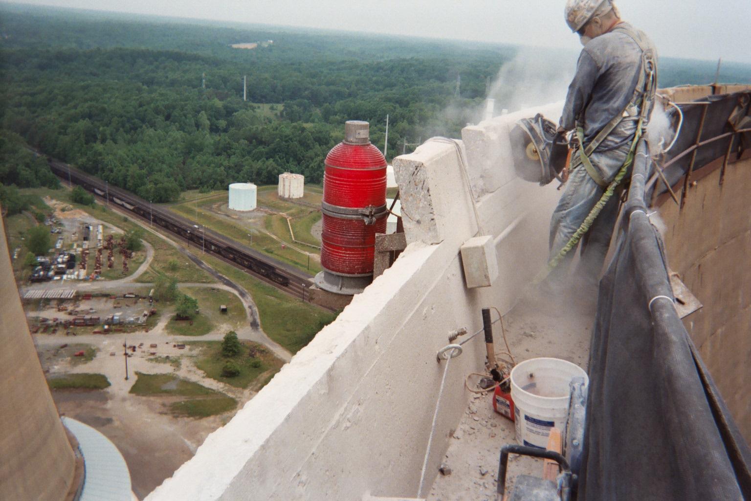 Concrete chop sawing work in progress by specialized worker.