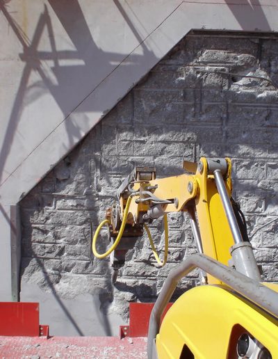 Robotic hammering work being done at a job site.