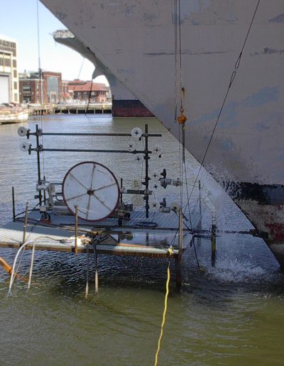Metal sawing of sonor dome being done under water.
