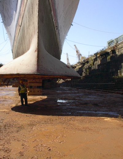 A large ship marooned for selective demolition work.