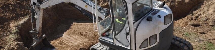 Mini Excavator bucket close-up. Heavy scoop of a cheap excavator