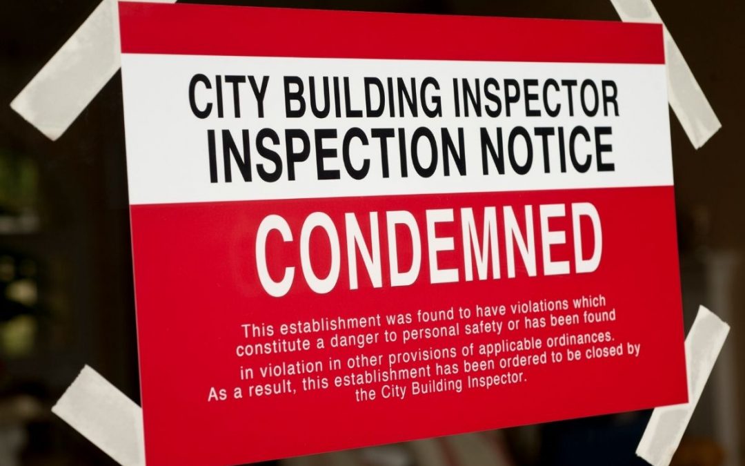 A picture of inspection notice for the building that is been condemned