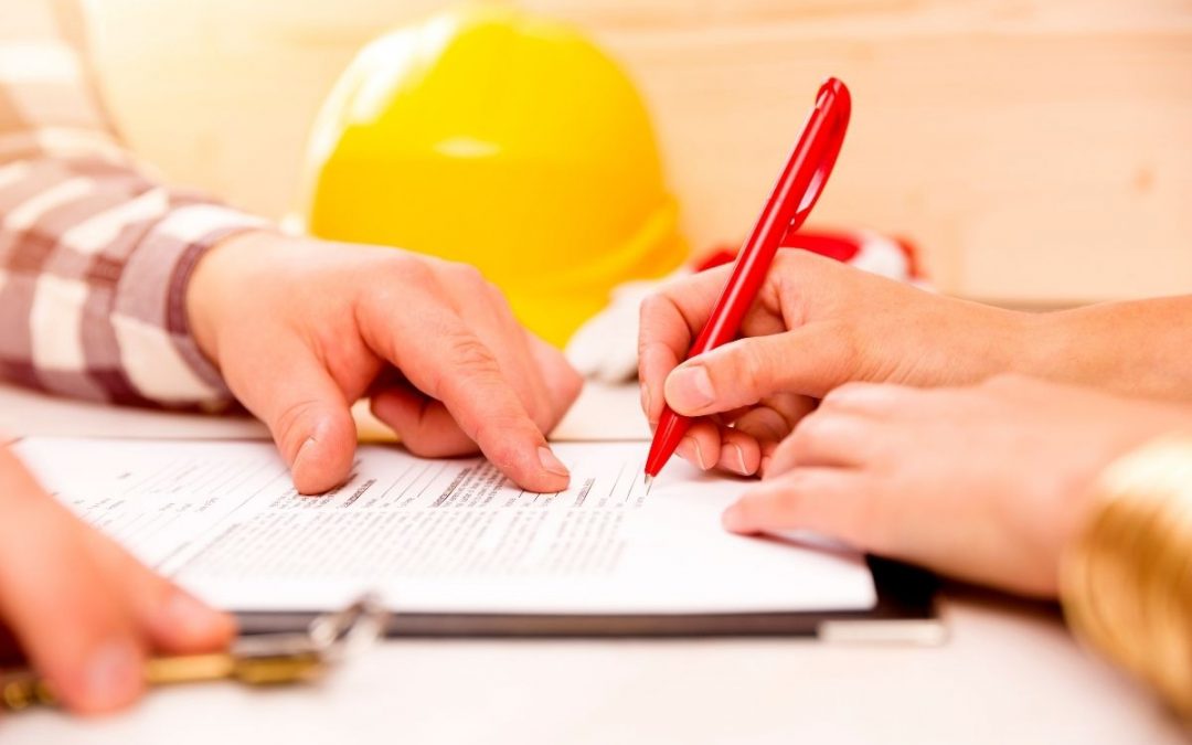A picture of a constructor filling up the notice to owner document